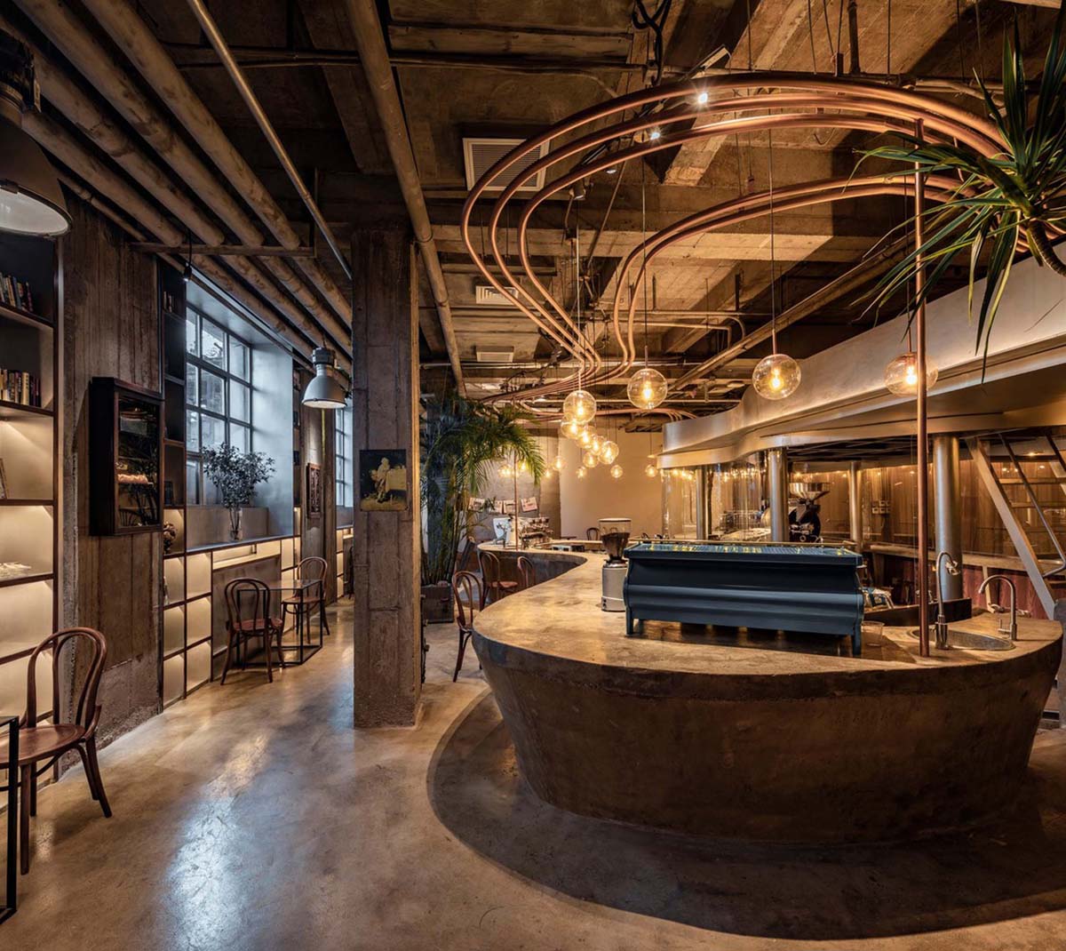 Linkchance Architects creates coffee store and art studio with golden metallic interiors in Beijing