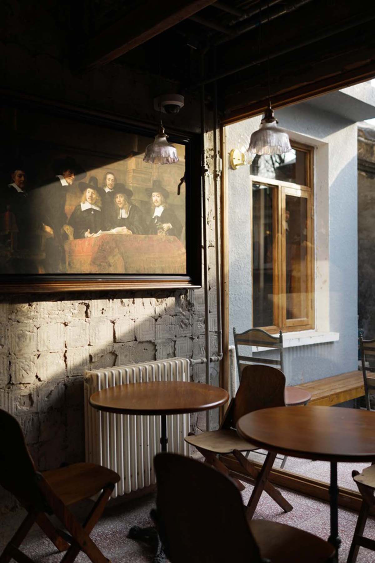 Linkchance Architects creates coffee store and art studio with golden metallic interiors in Beijing