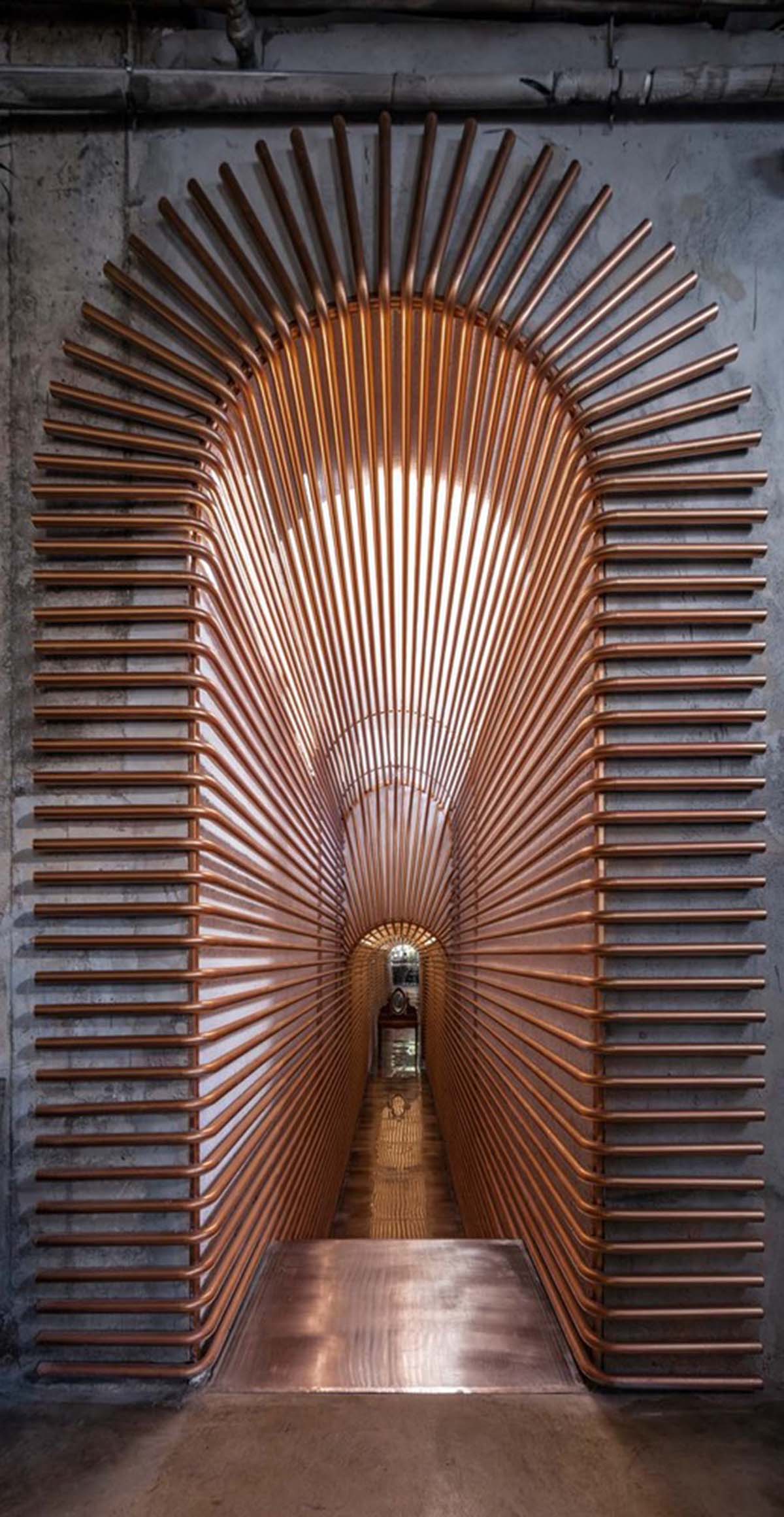 Linkchance Architects creates coffee store and art studio with golden metallic interiors in Beijing