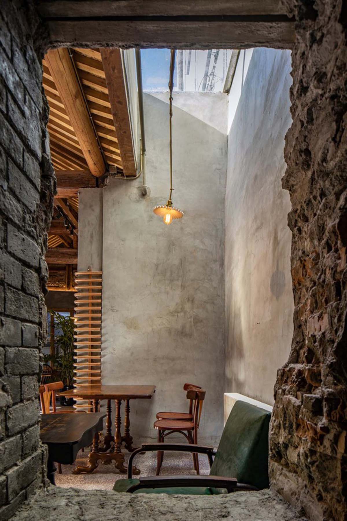 Linkchance Architects creates coffee store and art studio with golden metallic interiors in Beijing