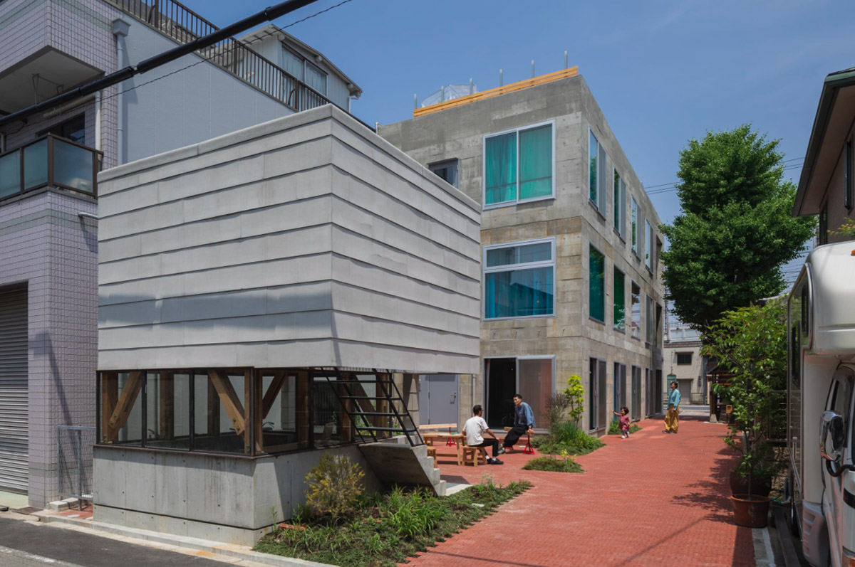 Tato Architects creates painted effect to this concrete hotel by using colourful curtains in Osaka