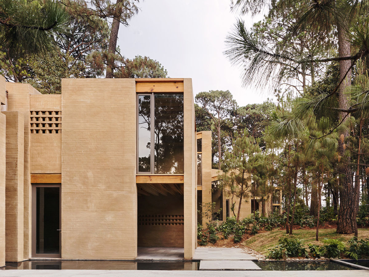 Taller Hector Barroso built five weekend houses from red-coloured terra-cotta in Mexican forest