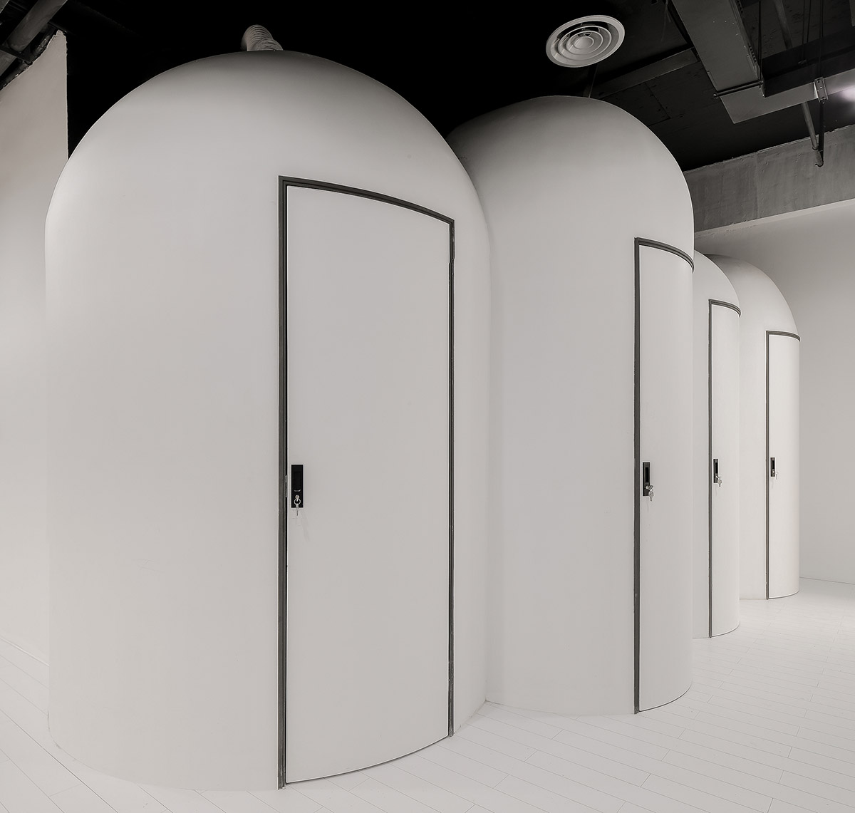 X+Living fills Shanghai's retail and shared office space with rounded details and machine-like rooms