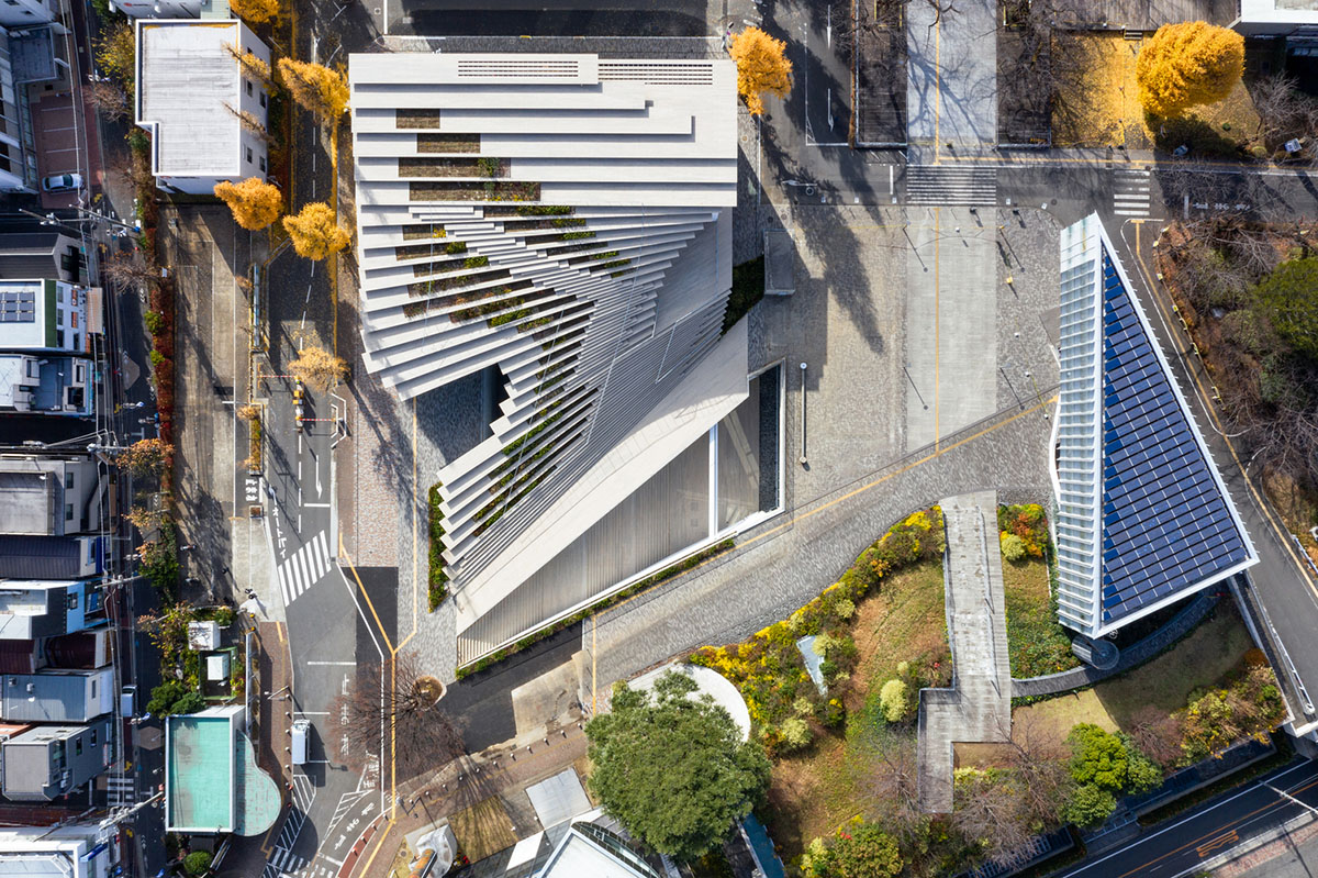 Kengo Kuma & Associates designs twisted student exchange hub featuring strip-like steps in Tokyo