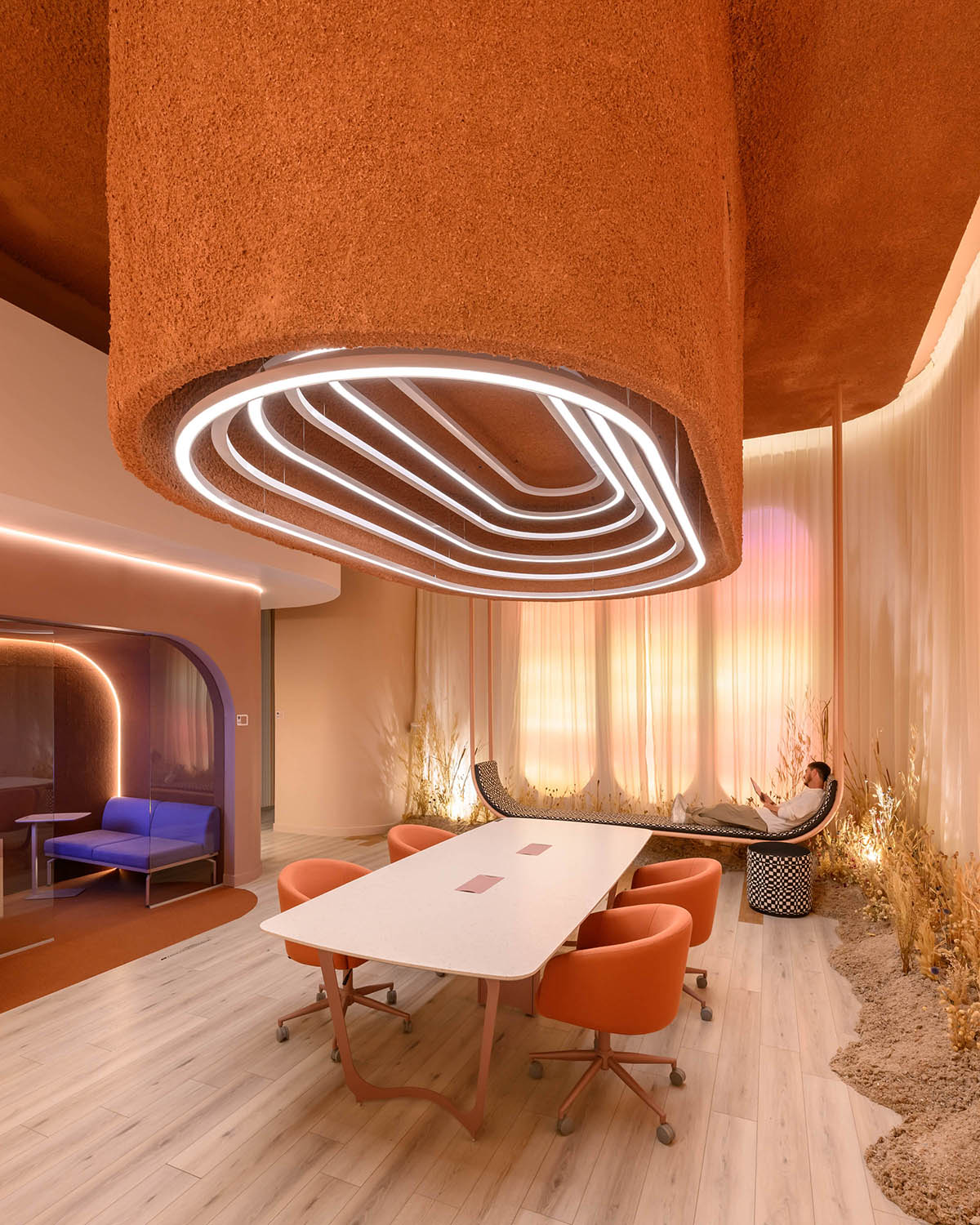 Estudio Ebras and Hause Möbel add orange hues and textures to home and office in Córdoba