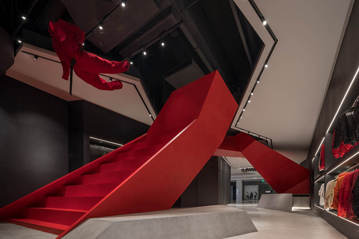 DOMANI adds bold red staircase to the interior of a Shenzhen store brand to create sensory illusion