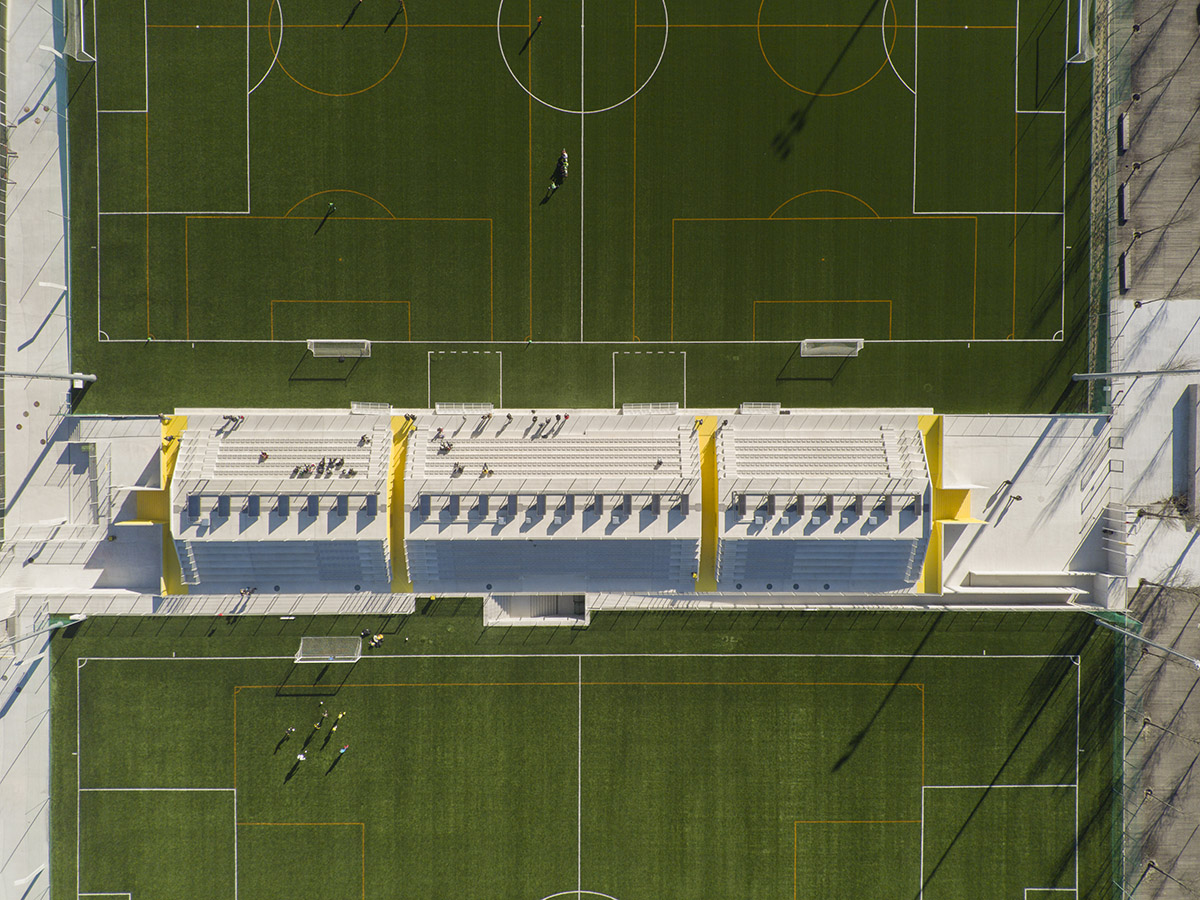 Summary highlights circulation and public areas of training facility of stadium with yellow color