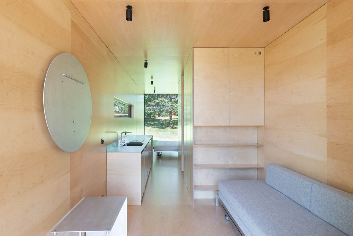 ŠA atelier designs linear black metal cabin to frame the view on natural terrain of Lithuania