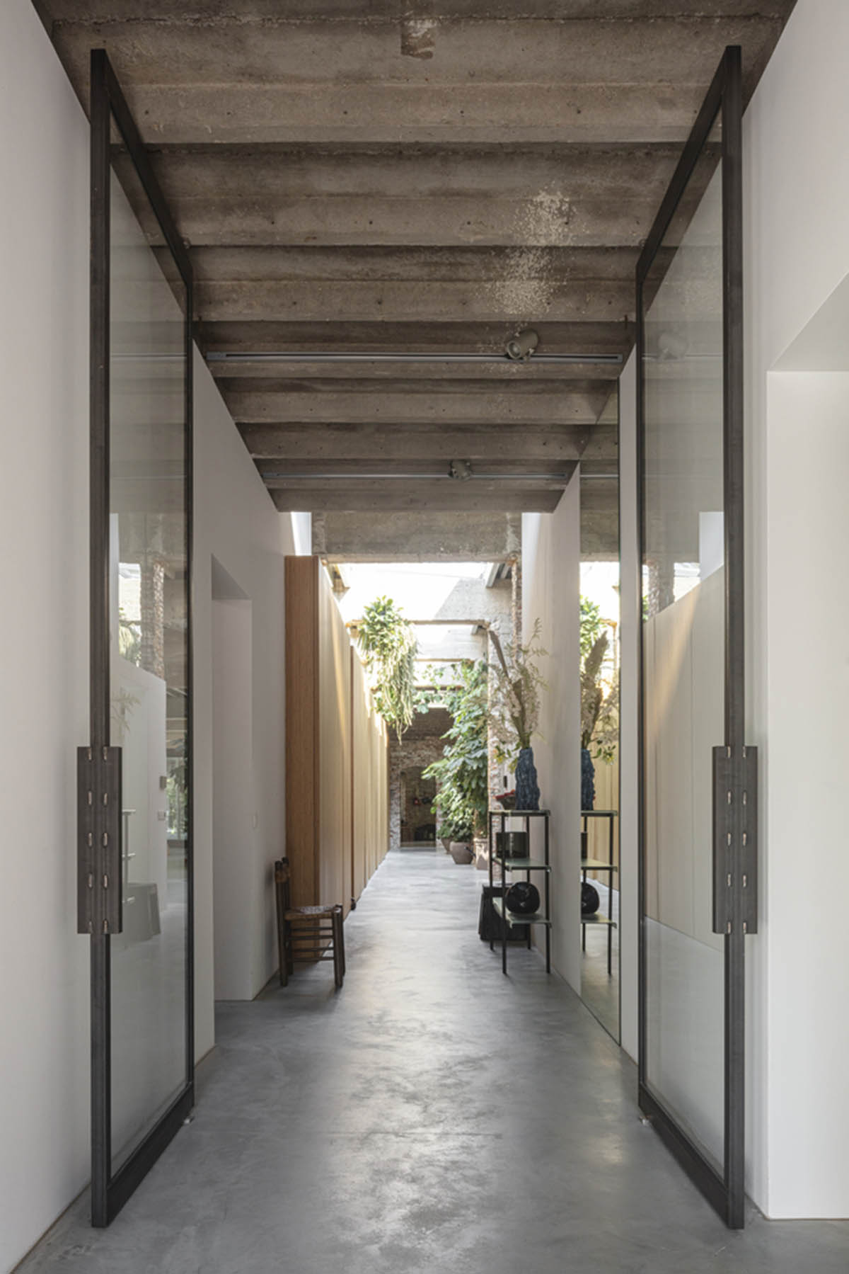 MASA architects converts abandoned 1940s sports building into new villa with naked brick walls 