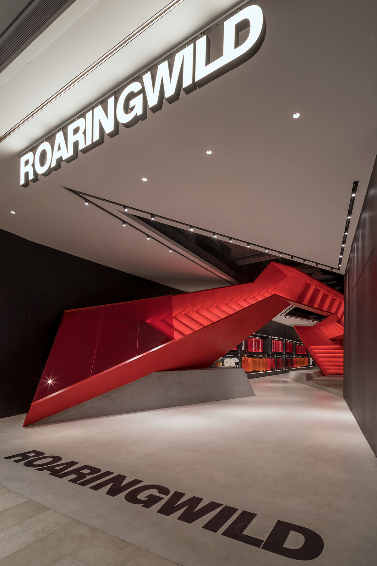 DOMANI adds bold red staircase to the interior of a Shenzhen store brand to create sensory illusion