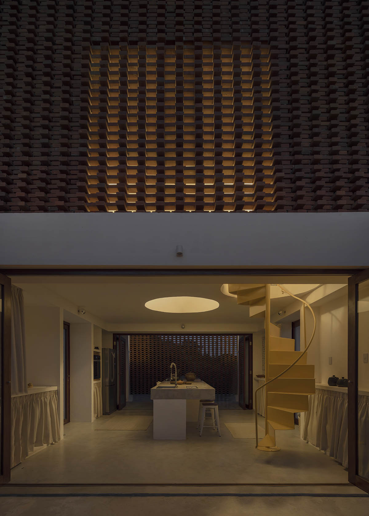 Atelier Matteo Arnone adds spacious brick tower to holiday home in Brazilian forest