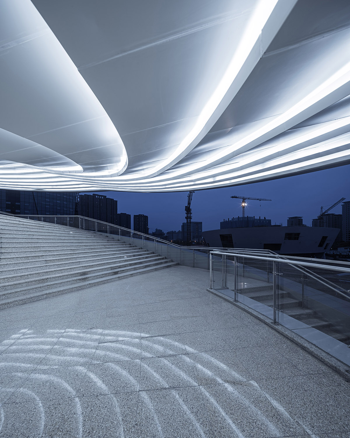 A Spiral Textile Center by Studio ATAH Adopts the Concept of Weaving