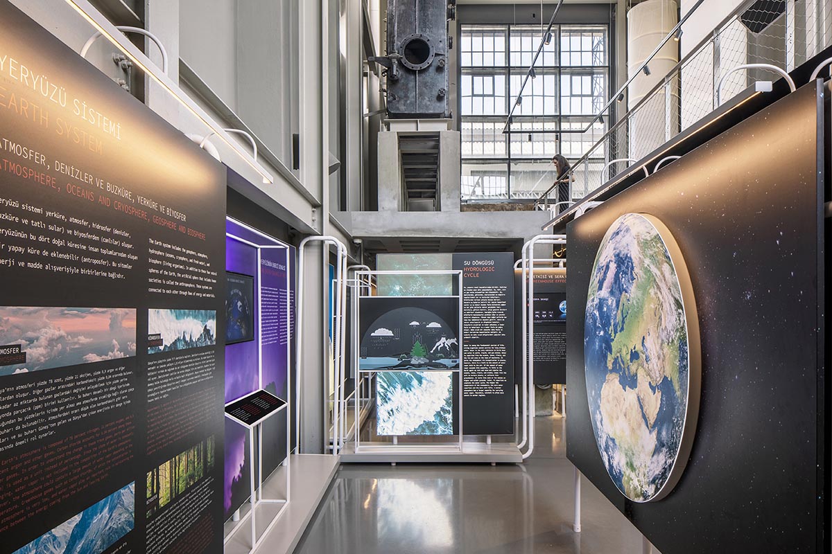 do[x]architecture softens robust industrial look of climate museum with colorful boards and lights