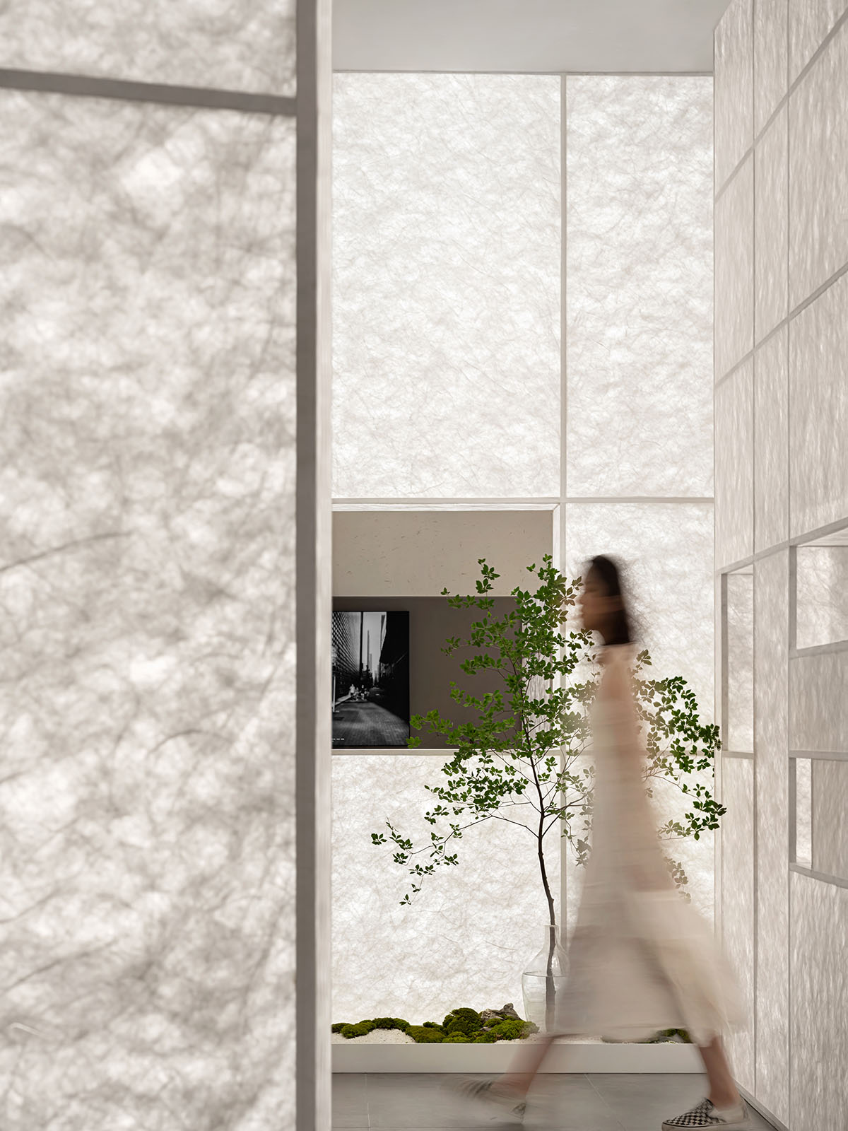 Luminous screen walls create fluid interiors for an optic store designed by Onexn Architects 