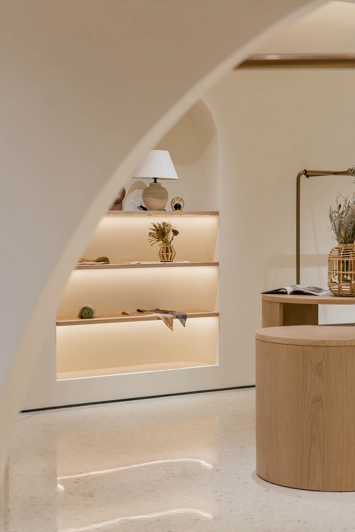 JYDP designs retail space with warm tones and curved walls in Shanghai