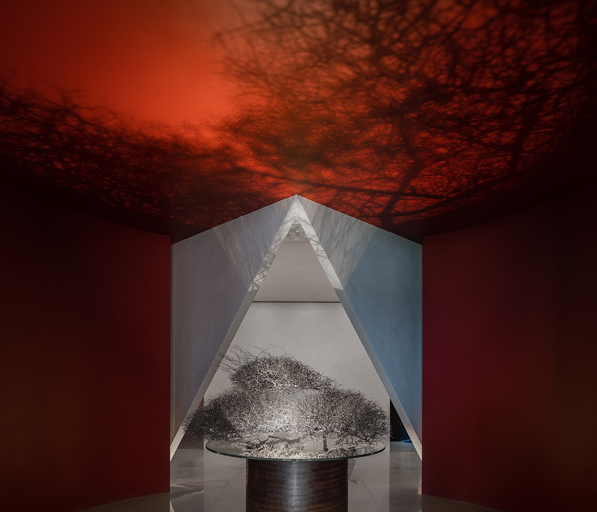 Masanori Designs' interiors include red cylinder bringing rainwater into the space