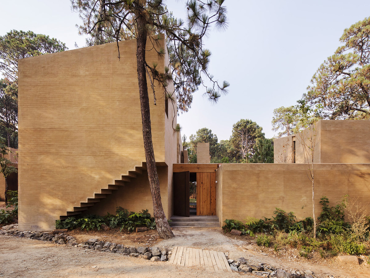 Taller Hector Barroso built five weekend houses from red-coloured terra-cotta in Mexican forest