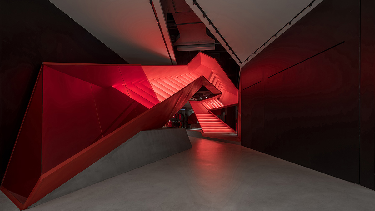 DOMANI adds bold red staircase to the interior of a Shenzhen store brand to create sensory illusion