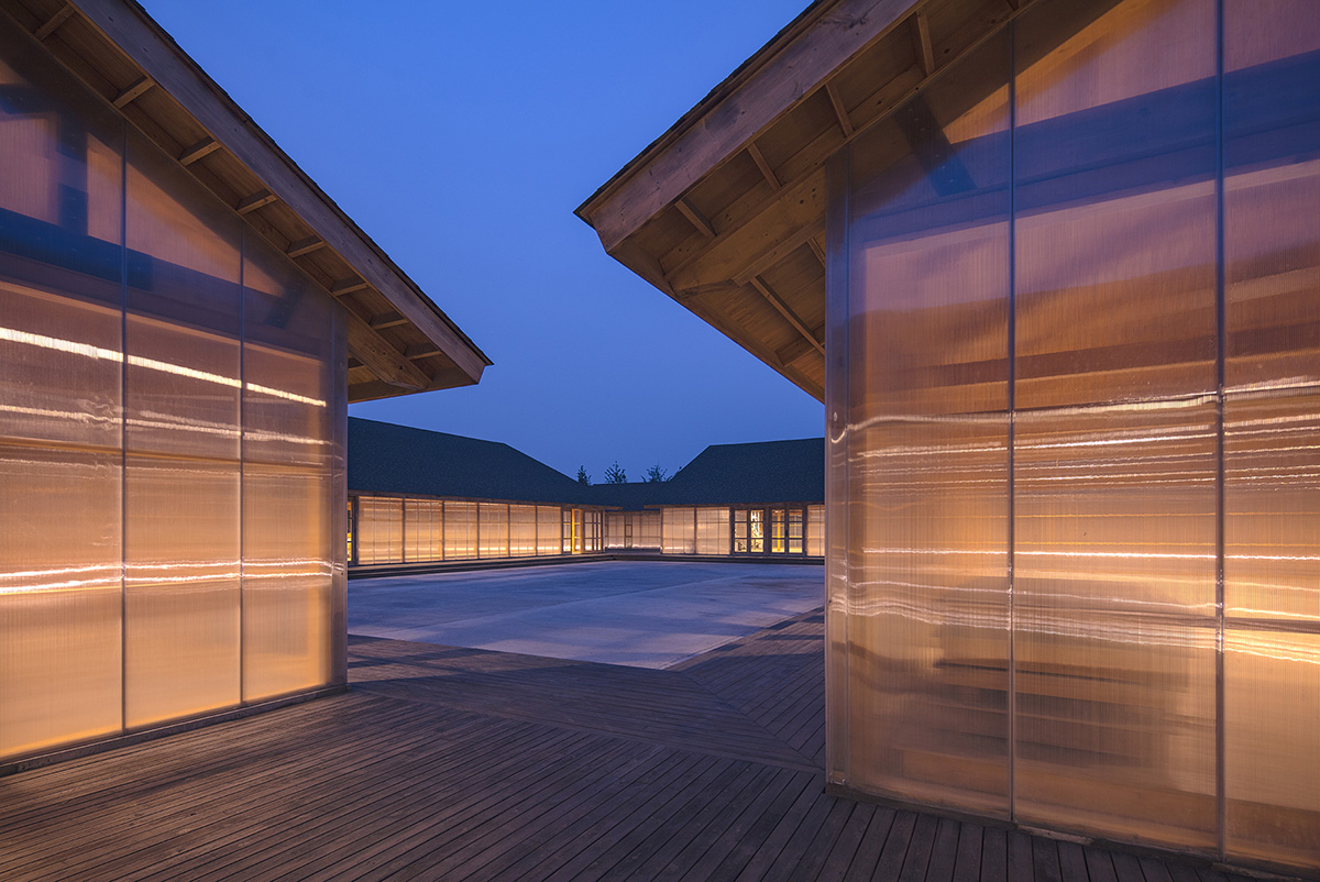 Arch Studio wraps this Organic Farm with translucent pc boards to easy food processing