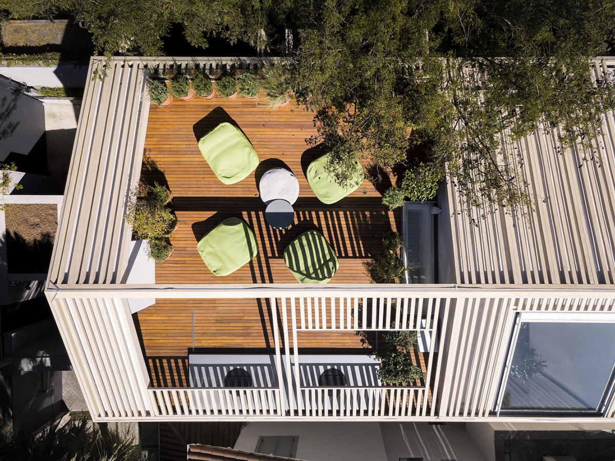 Studio AG designed large wooden residence featuring punctured volumes with gabled roof in São Paulo