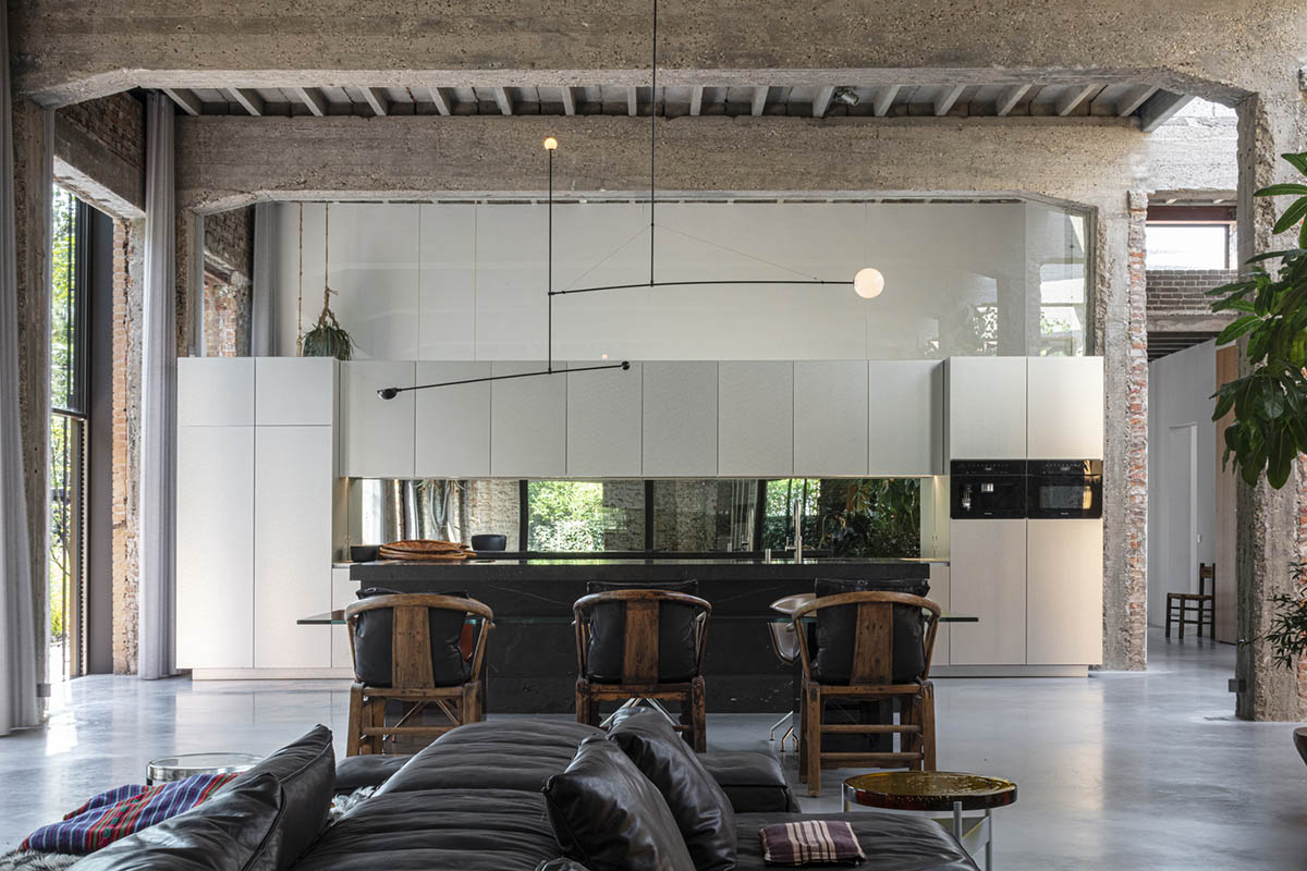 MASA architects converts abandoned 1940s sports building into new villa with naked brick walls 