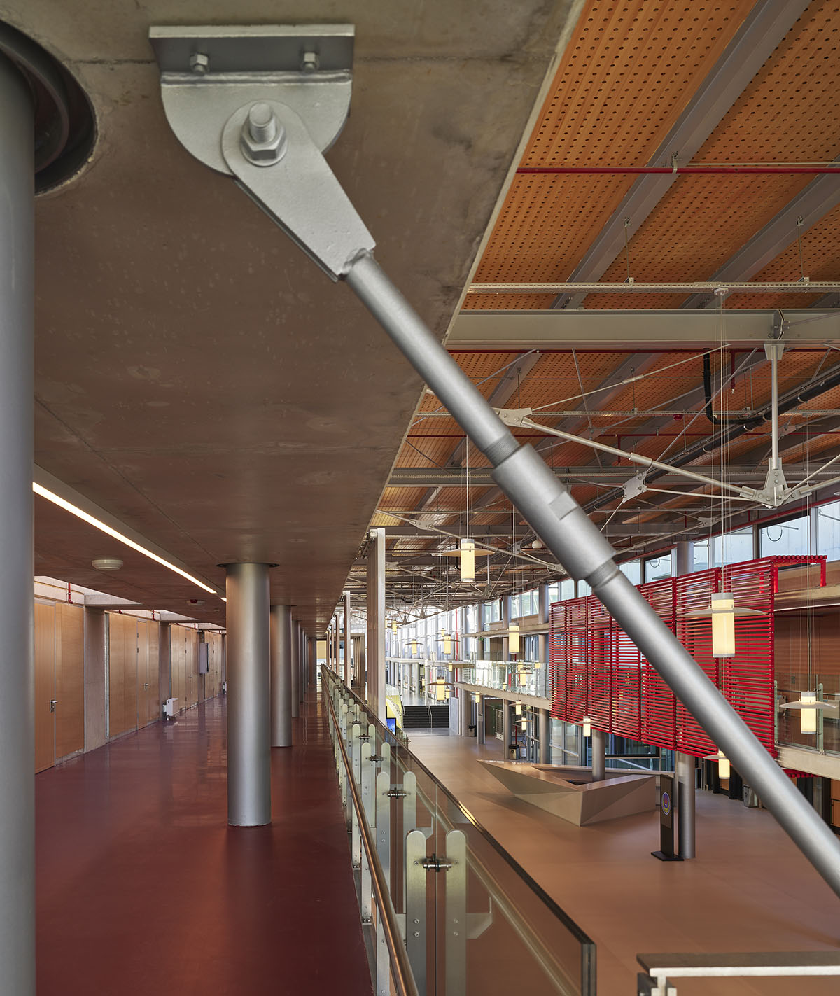 Uygur Architects articulates performing arts center façade with wooden triangulating surfaces