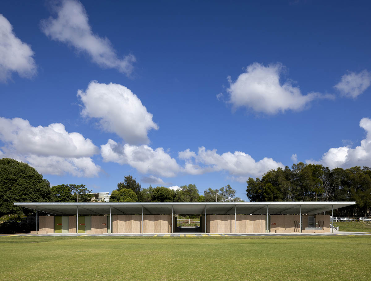 Sports pavilion is made of zigzagging brick walls referencing serrated leaves of endangered banksia