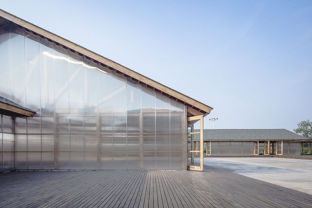 Arch Studio wraps this Organic Farm with translucent pc boards to easy food processing