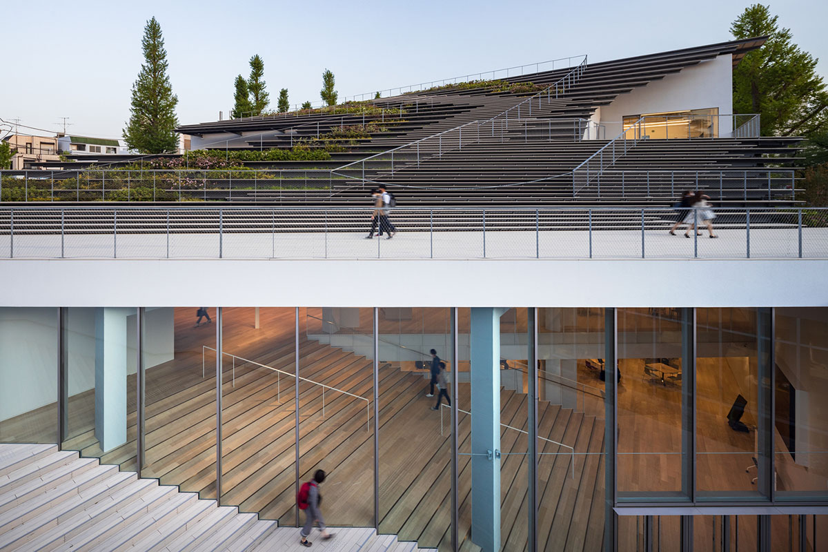 Kengo Kuma & Associates designs twisted student exchange hub featuring strip-like steps in Tokyo