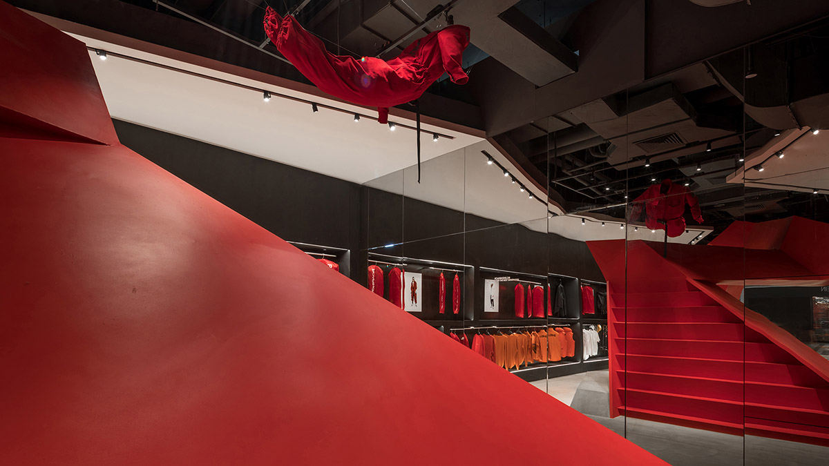 DOMANI adds bold red staircase to the interior of a Shenzhen store brand to create sensory illusion