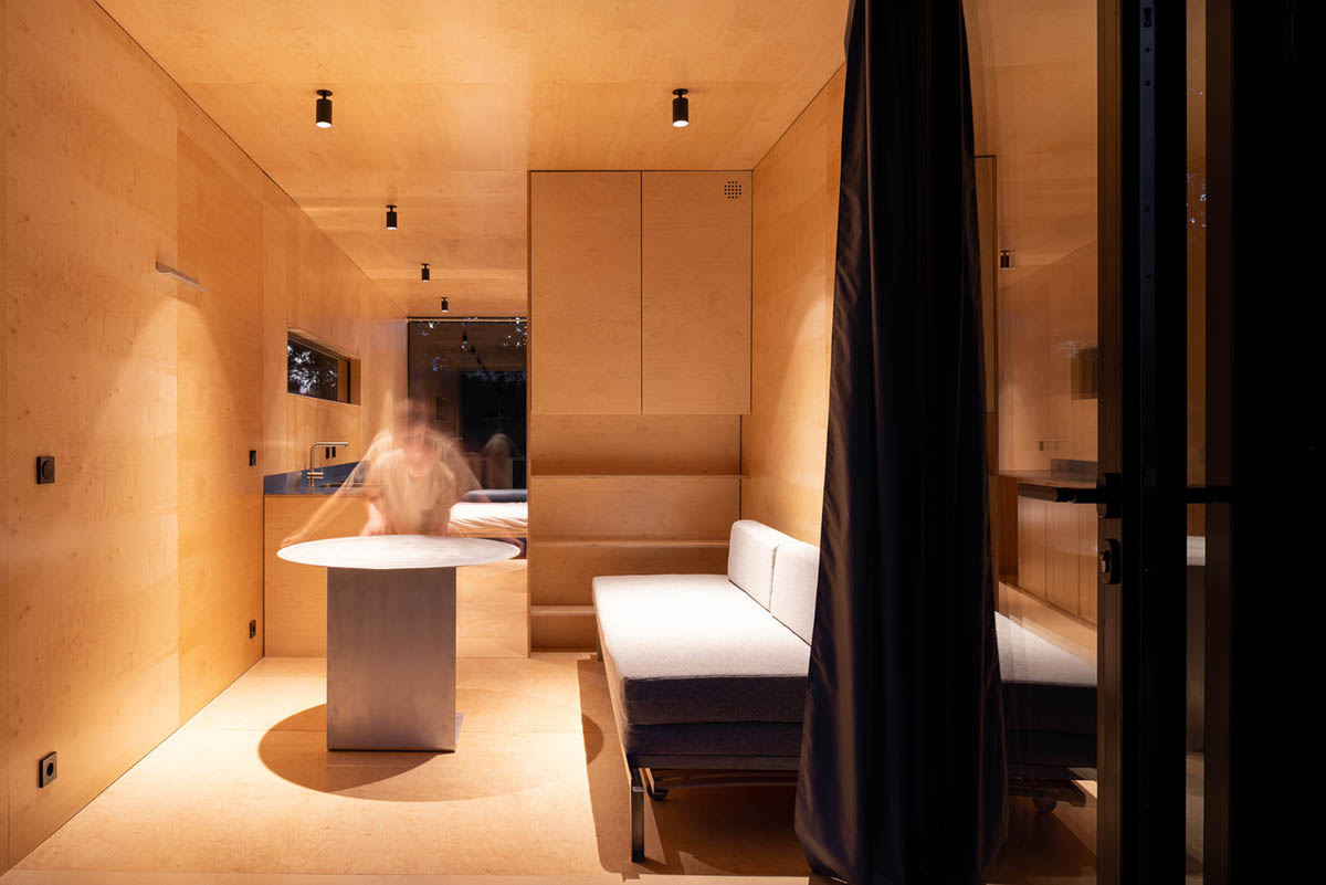 ŠA atelier designs linear black metal cabin to frame the view on natural terrain of Lithuania