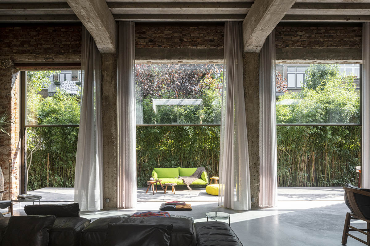 MASA architects converts abandoned 1940s sports building into new villa with naked brick walls