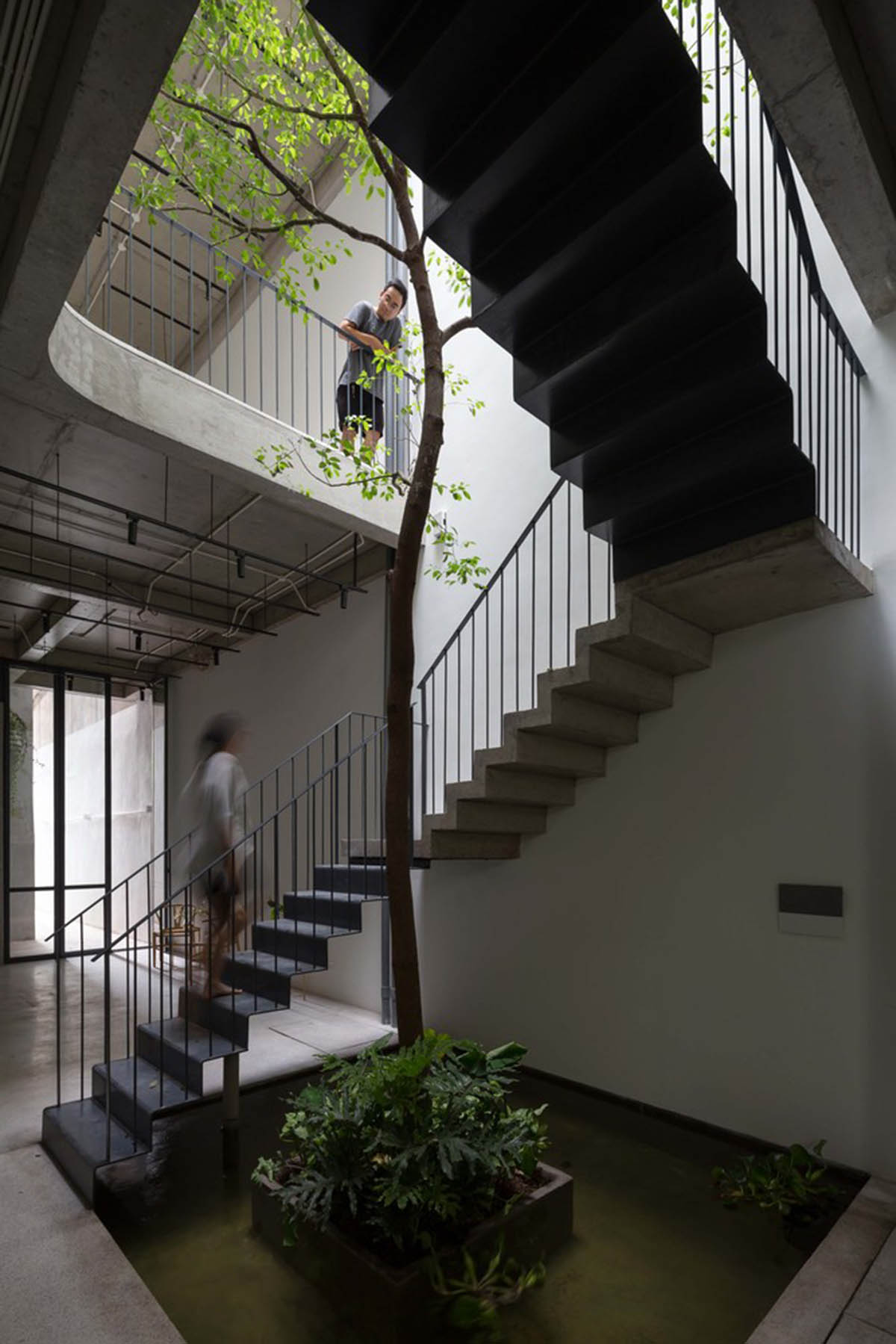 ODDO architects built this narrow house with rich interior spaces and perforated skin in Hanoi