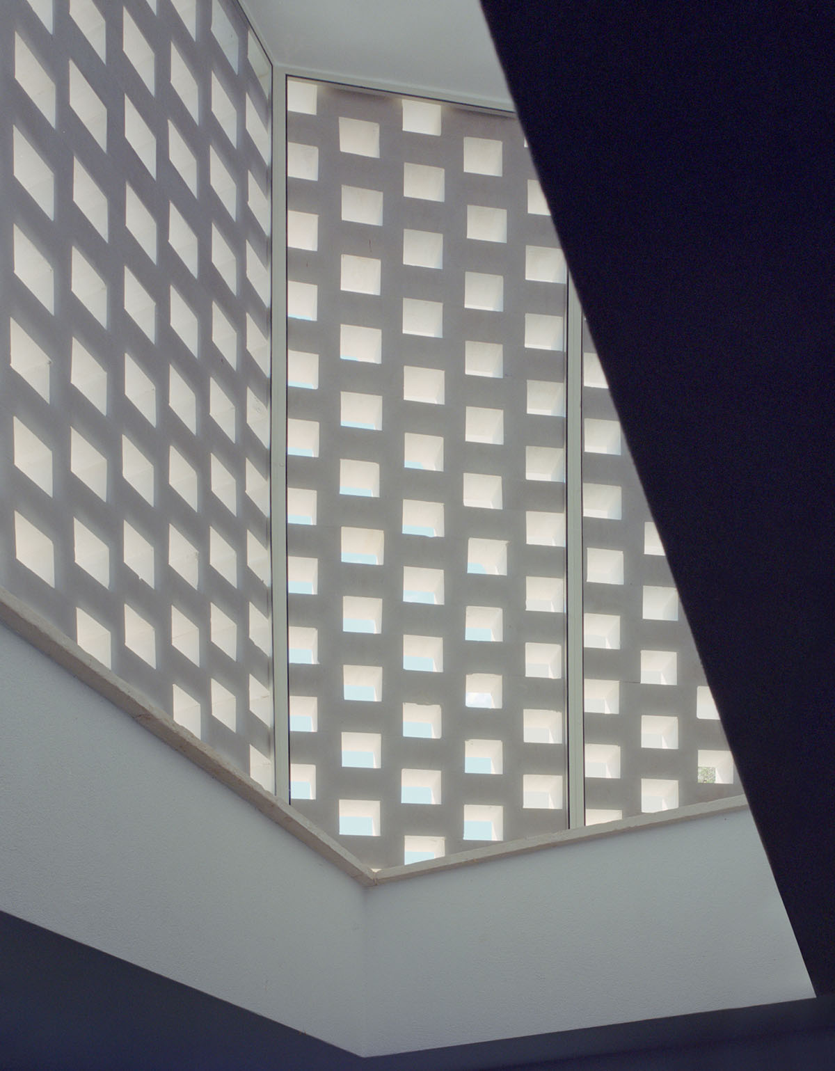 Rural retreat filters light through its stone porous screen in the Salento countryside