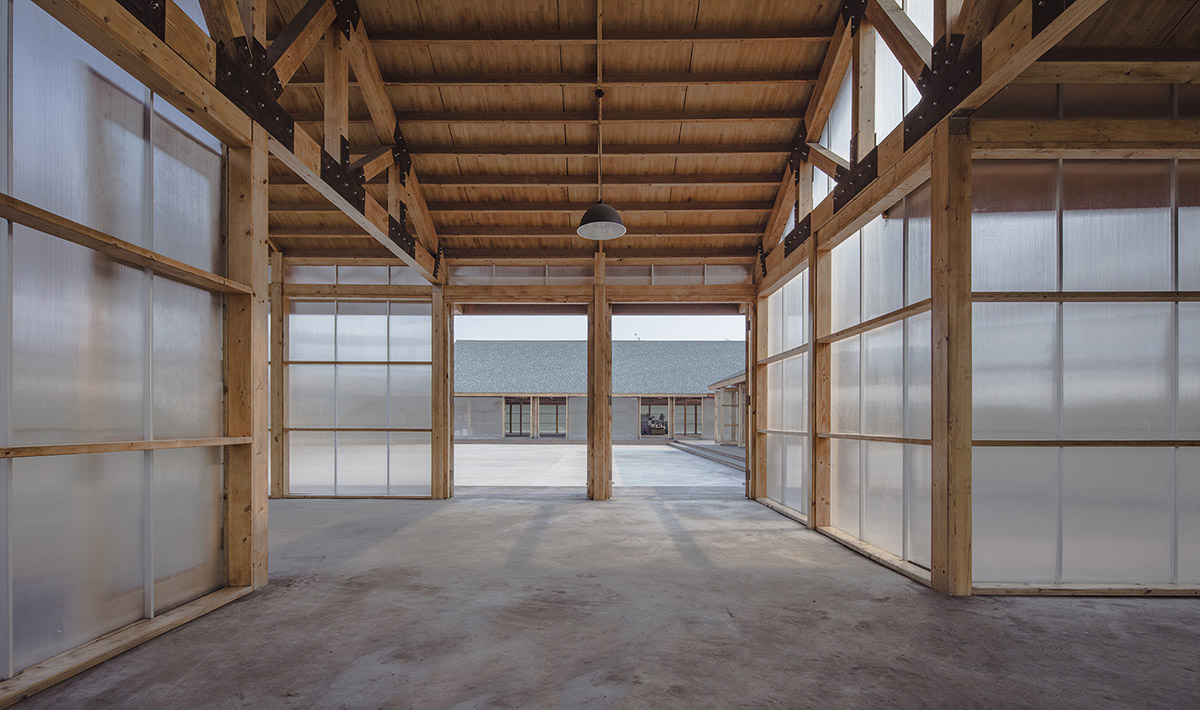 Arch Studio wraps this Organic Farm with translucent pc boards to easy food processing