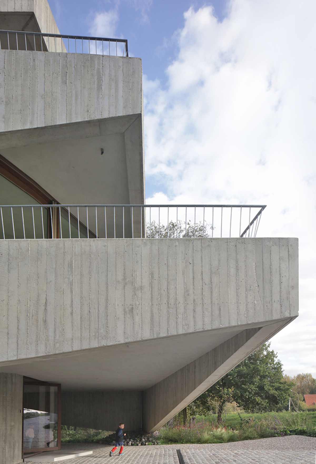 Belgian house by GRAUX & BAEYENS Architecten features asymmetrical angled concrete canopies