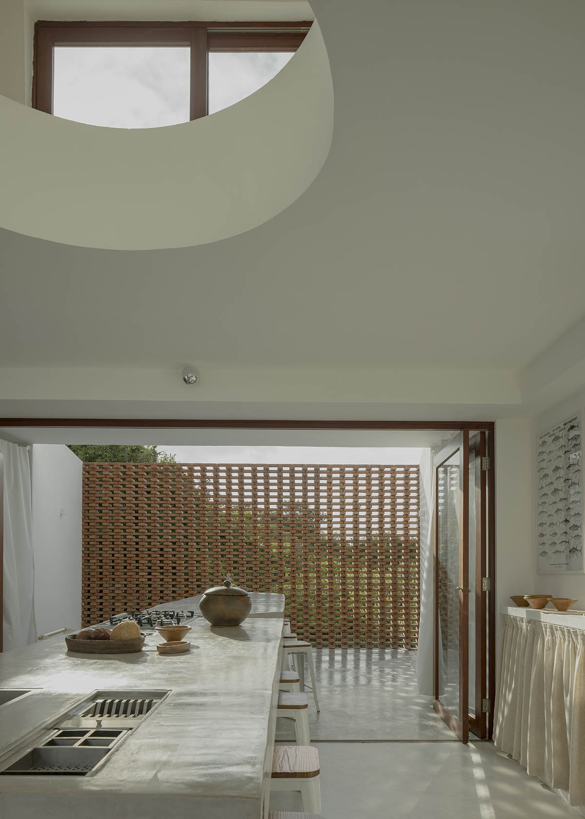 Atelier Matteo Arnone adds spacious brick tower to holiday home in Brazilian forest