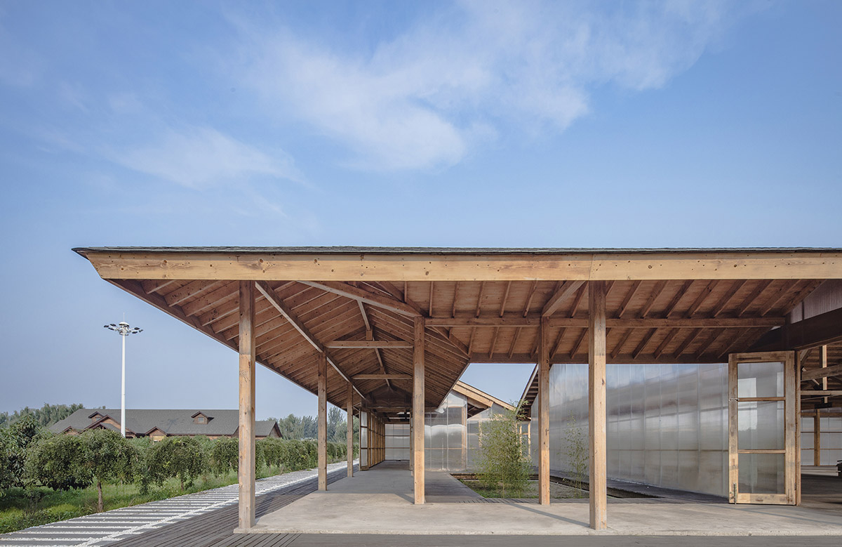 Arch Studio wraps this Organic Farm with translucent pc boards to easy food processing