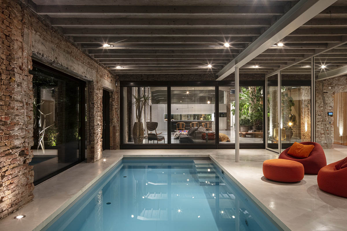 MASA architects converts abandoned 1940s sports building into new villa with naked brick walls 