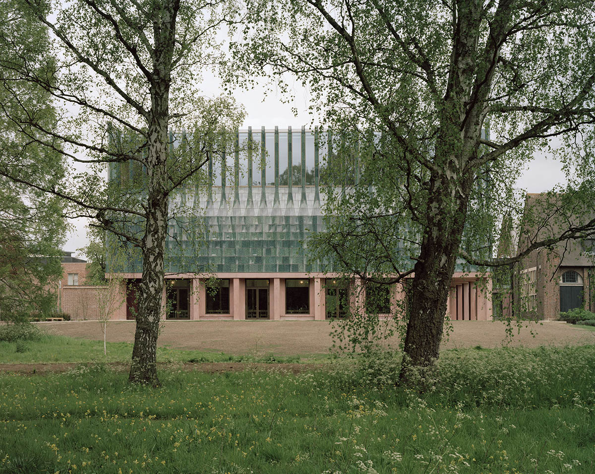 Feilden Fowles completes dining hall wrapped in green faience tiles at University of Cambridge