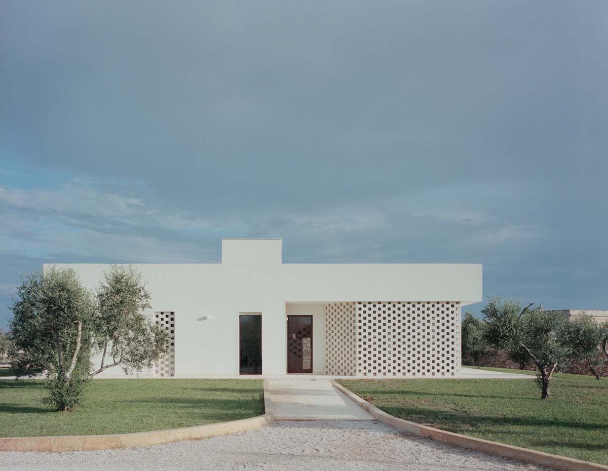 Rural retreat filters light through its stone porous screen in the Salento countryside