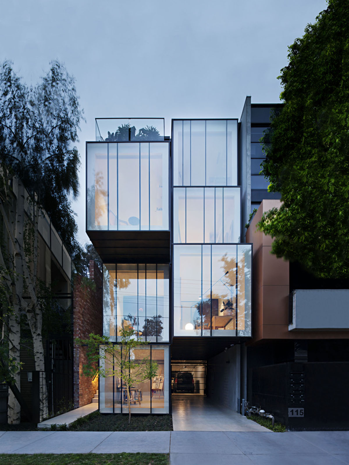 Protruding glass boxes form mixed-use housing in a narrow plot in Melbourne
