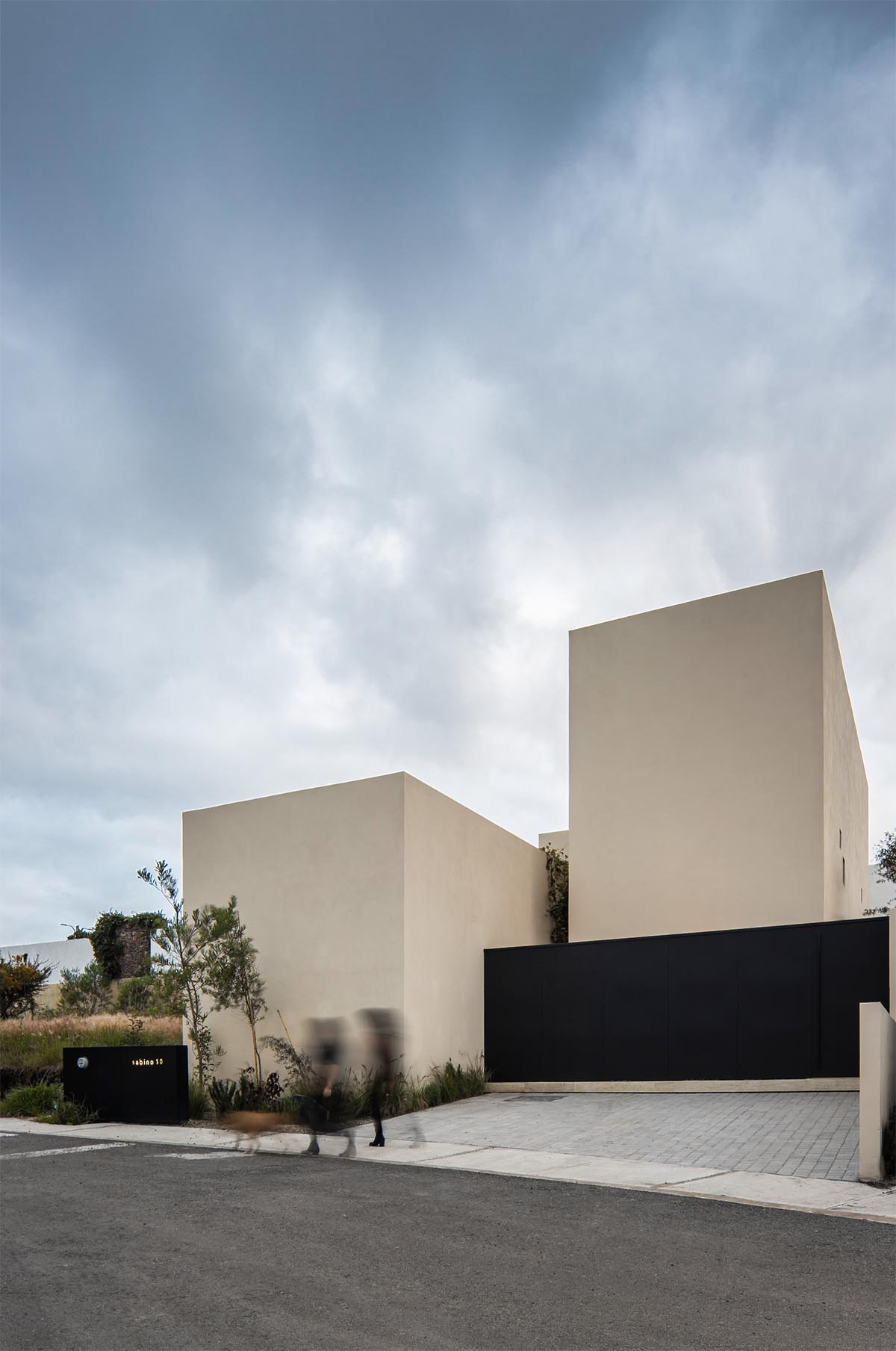 Sabino 10 residence by Editorial features a solid façade with hermetic volumes in Mexico