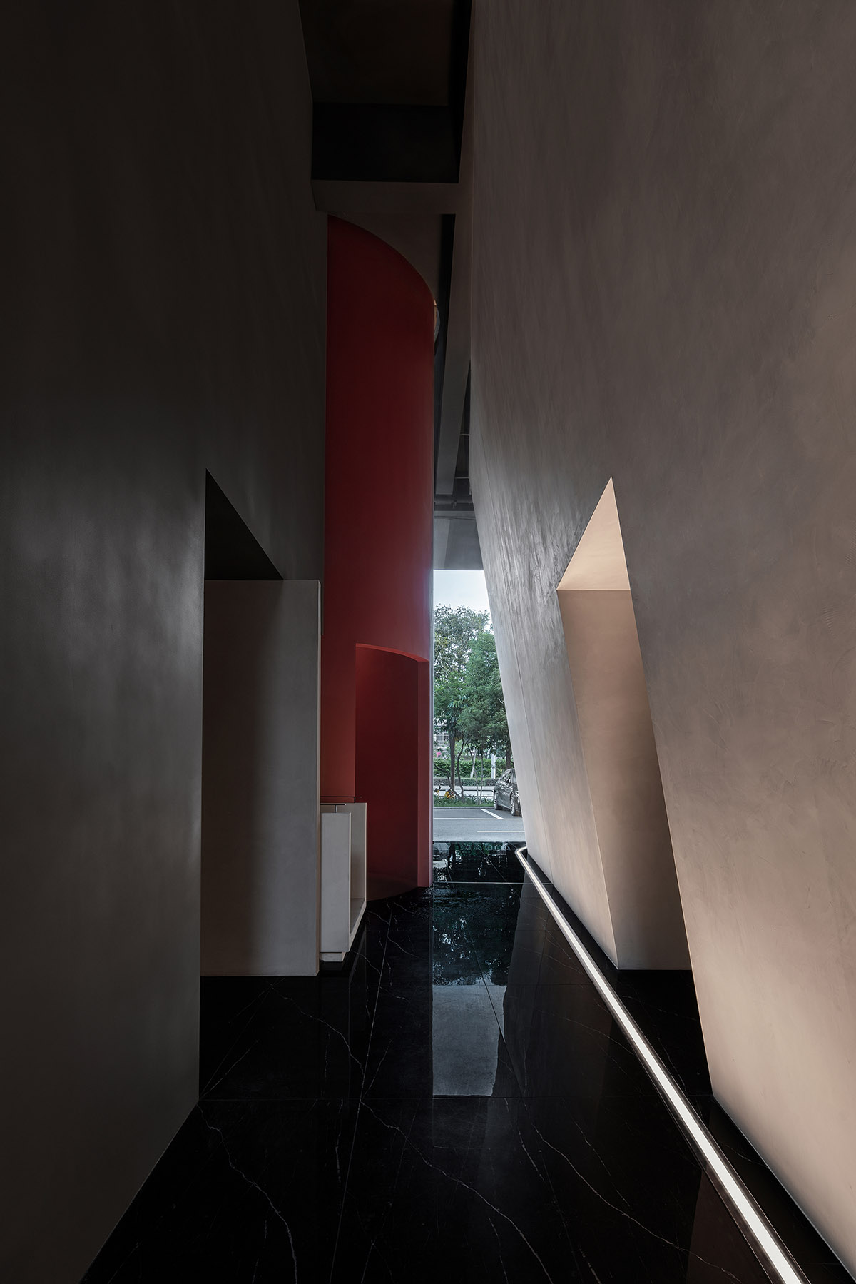 Masanori Designs' interiors include red cylinder bringing rainwater into the space