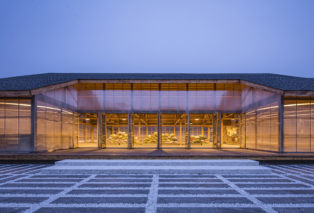 Arch Studio wraps this Organic Farm with translucent pc boards to easy food processing