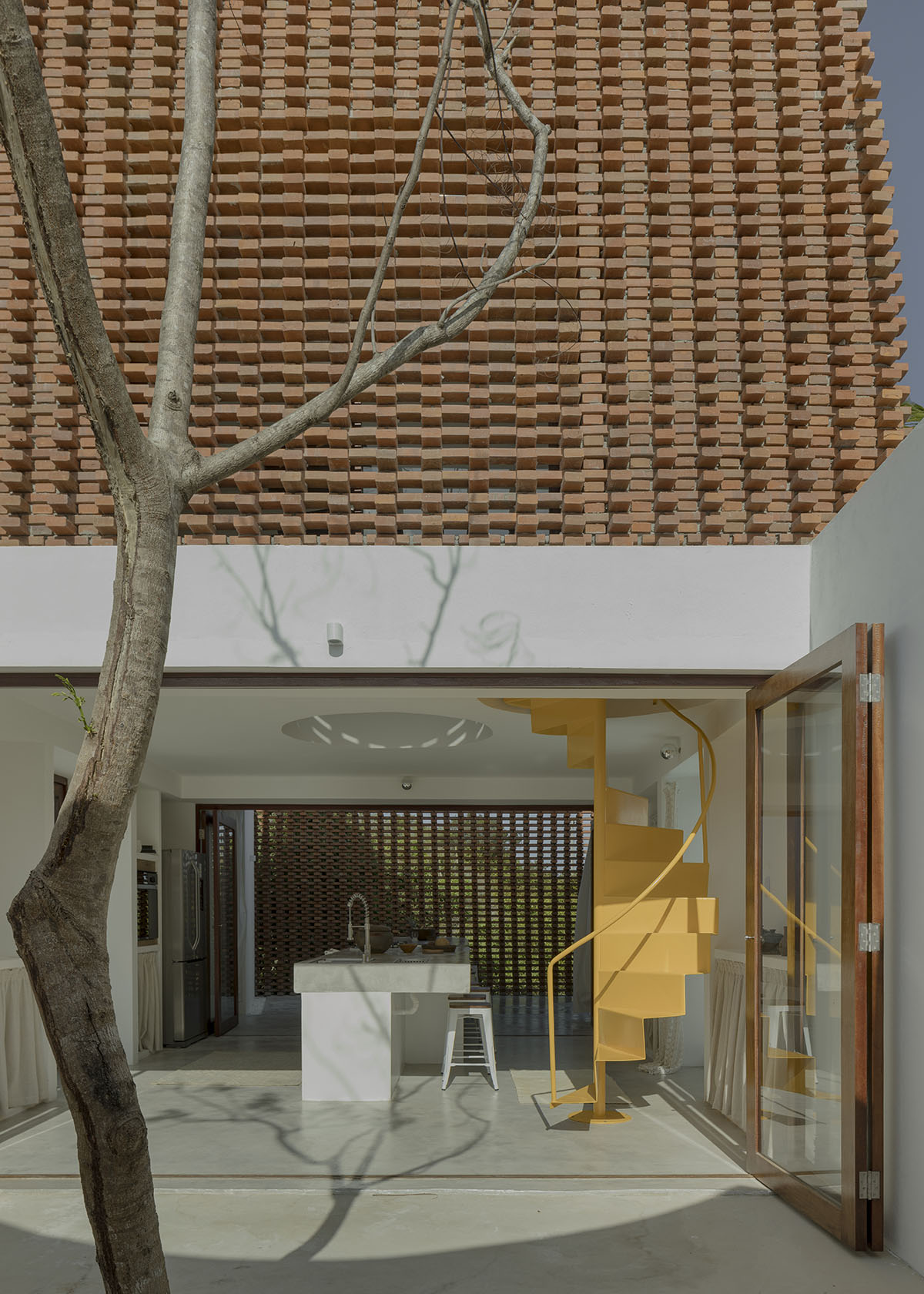 Atelier Matteo Arnone adds spacious brick tower to holiday home in Brazilian forest
