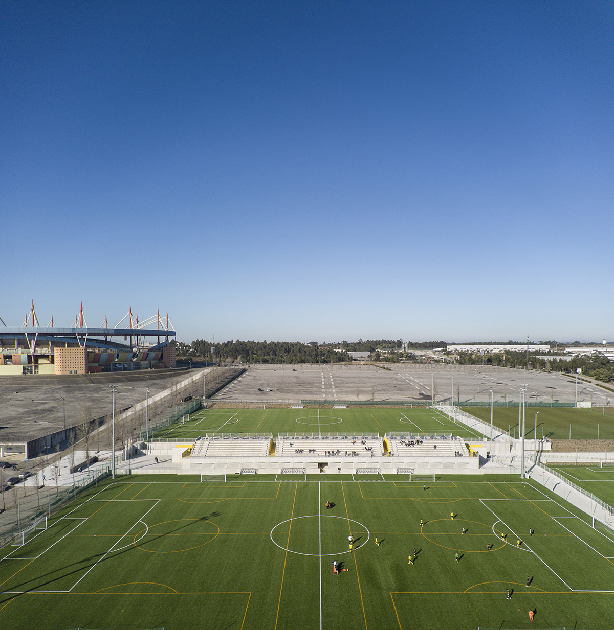Summary highlights circulation and public areas of training facility of stadium with yellow color