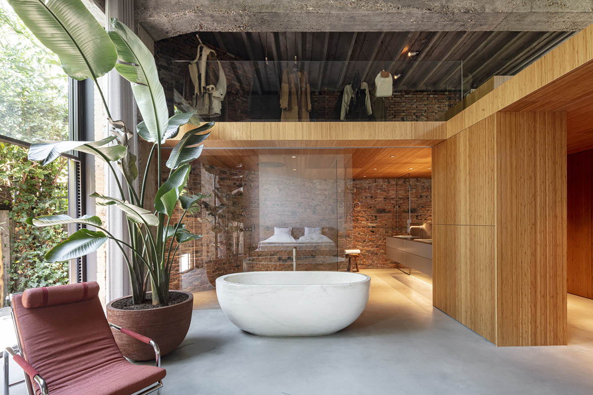 MASA architects converts abandoned 1940s sports building into new villa with naked brick walls 