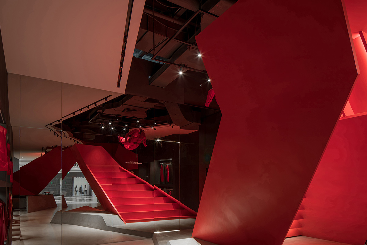 DOMANI adds bold red staircase to the interior of a Shenzhen store brand to create sensory illusion