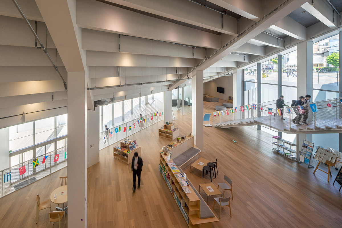 Kengo Kuma & Associates designs twisted student exchange hub featuring strip-like steps in Tokyo